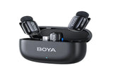  BOYA Mini 15 dual wireless microphone with charging case open showing two compact clip-on transmitters inside.