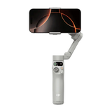 DJI Osmo Mobile 7 smartphone gimbal with built-in tripod and magnetic phone clamp