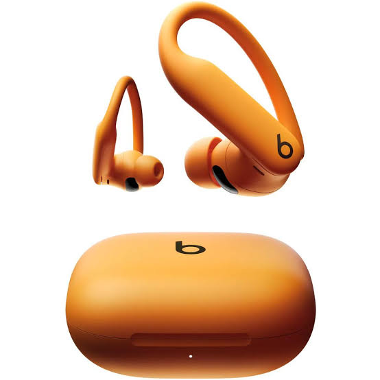 Powerbeats Pro 2 Electric Orange workout earbuds with secure earhooks and matching charging case