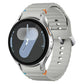 Samsung Galaxy Watch7 44mm silver smartwatch in side angle with grey sport band